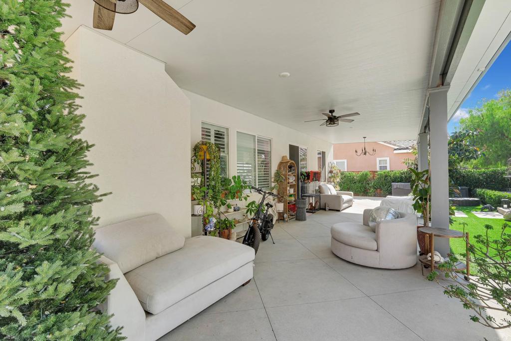8359 Clover Creek Road Riverside, CA 92508 - Photo 36 of 42 a view of a patio with couches and potted plants