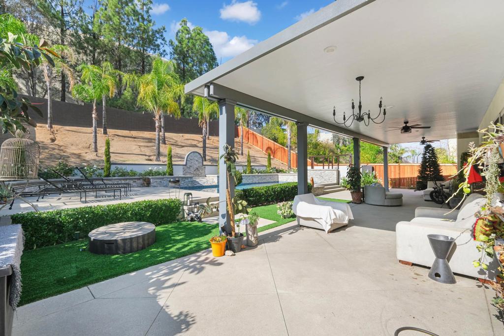 8359 Clover Creek Road Riverside, CA 92508 - Photo 40 of 42 a view of a patio with a table chairs and a patio