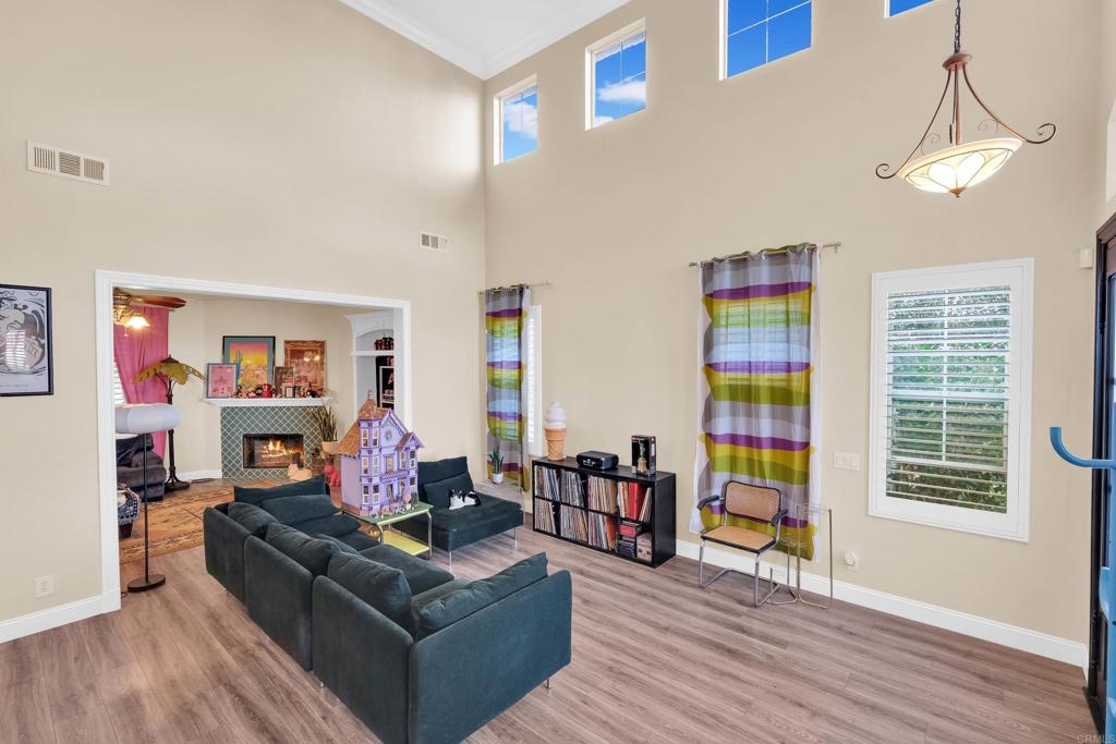 8359 Clover Creek Road Riverside, CA 92508 - Photo 6 of 42 a living room with furniture and a wooden floor
