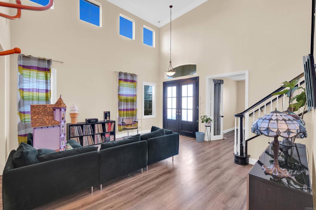 8359 Clover Creek Road Riverside, CA 92508 - Photo 7 of 42 a living room with furniture and wooden floor