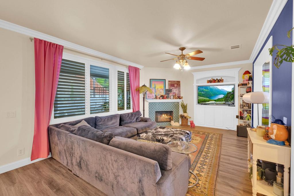 8359 Clover Creek Road Riverside, CA 92508 - Photo 9 of 42 a living room with furniture and a fireplace