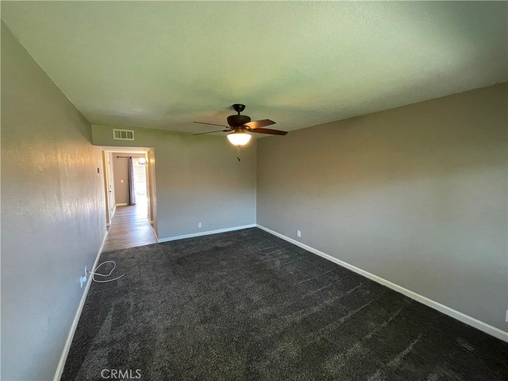 979 West Pine Street Upland, CA 91786 - Photo 4 of 18 an empty room with a empty space and windows