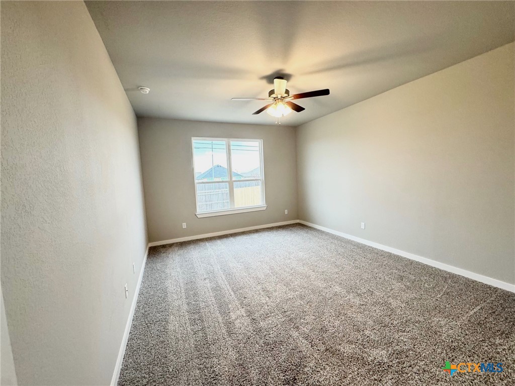 1529 Hillside Drive Temple, TX 76502 - Photo 16 of 19 wooden floor in an empty room with a window