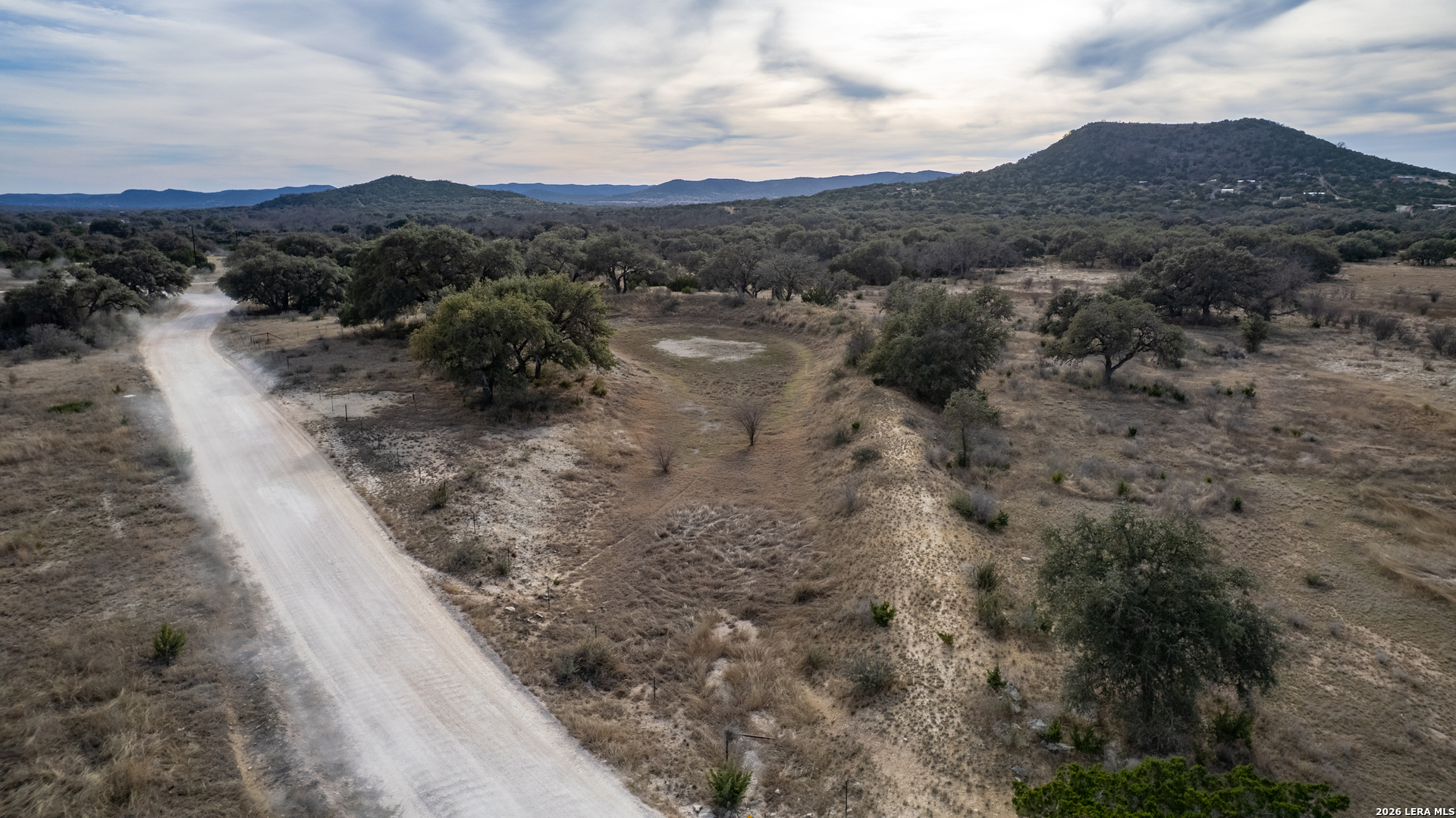 0 Little Dry Frio Road Rio Frio, TX 78879 - Photo 16 of 17 a view of a dry yard with mountains in the background