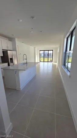 a view of livingroom with furniture and window