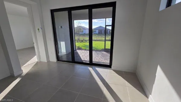 a view of an empty room with a balcony