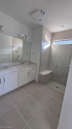 a large bathroom with a sink a toilet and a shower