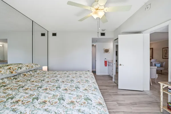 a spacious bathroom with a granite countertop sink mirror and a