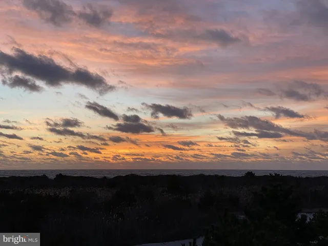 a view of a balcony with wooden floor