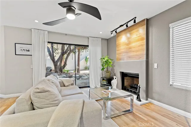 a bedroom with a bed couch and window