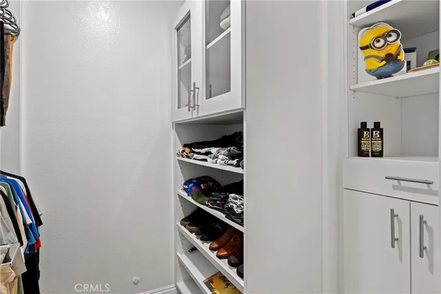 a view of storage and utility room with washer and dryer