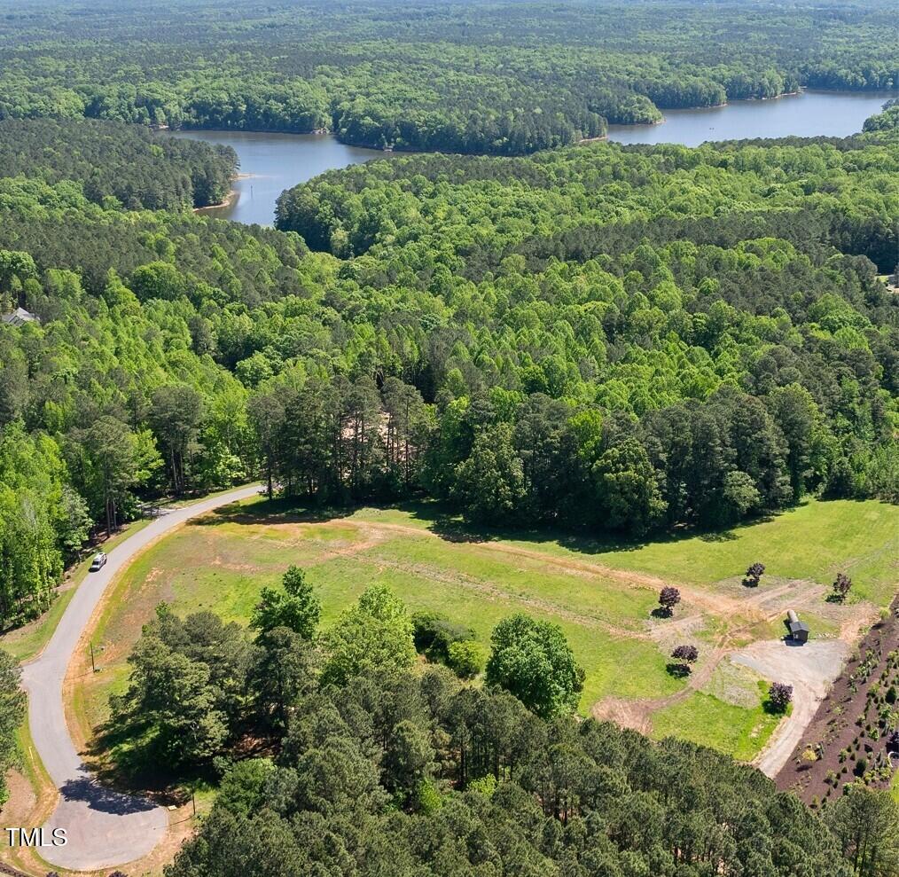429 Shinleaf Pond Trail Raleigh, NC 27614 - Photo 28 of 31 an aerial view of a house with a yard and lake view