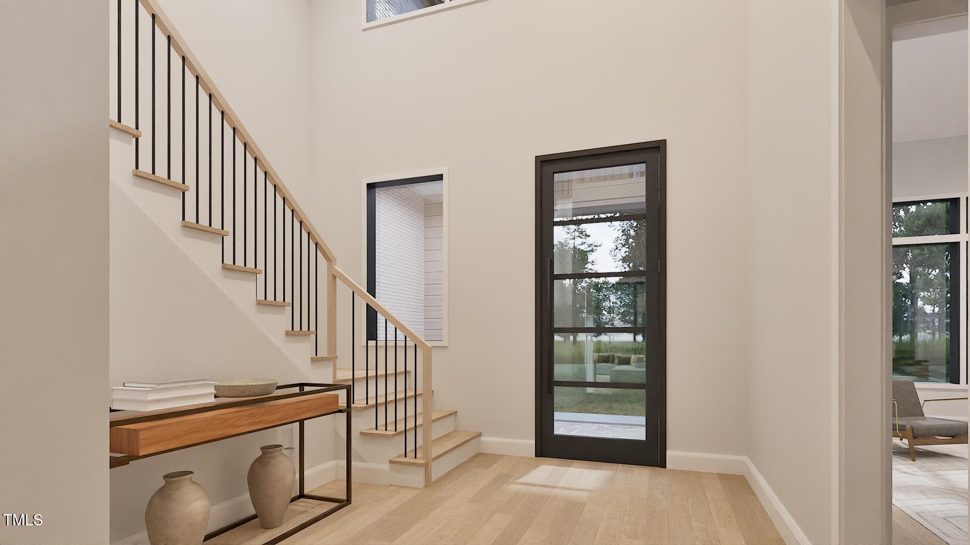 429 Shinleaf Pond Trail Raleigh, NC 27614 - Photo 6 of 31 a view of an entryway with a floor to ceiling window and stairs