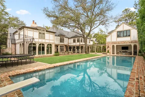a view of a house with swimming pool