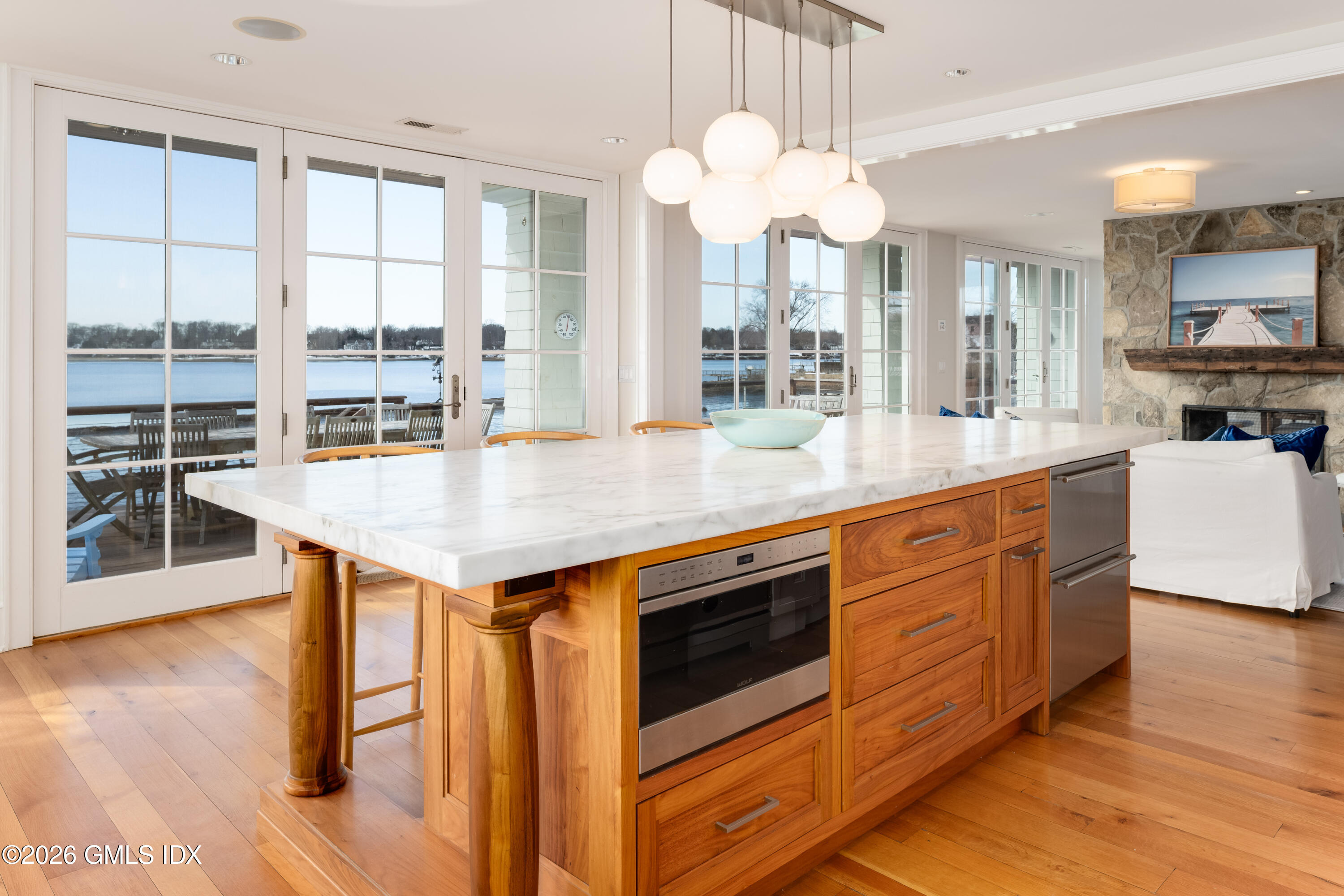 189 Shore Road Old Greenwich, CT 06870 - Photo 8 of 38 a open kitchen with stainless steel appliances granite countertop a stove and a wooden floors