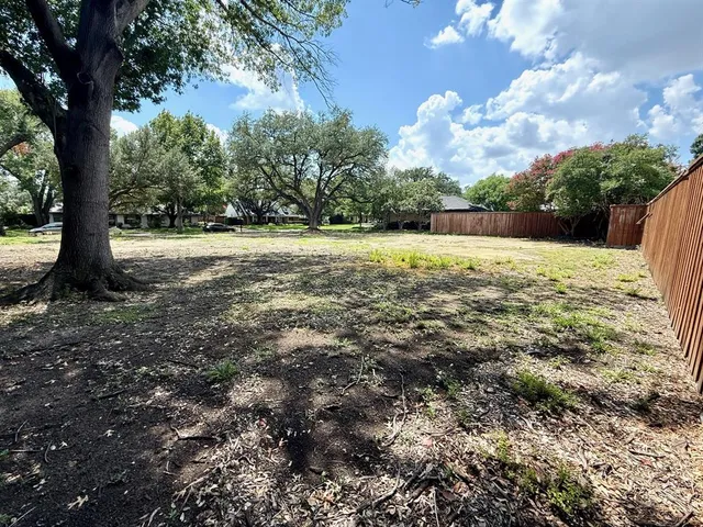 a view of outdoor space with deck and yard