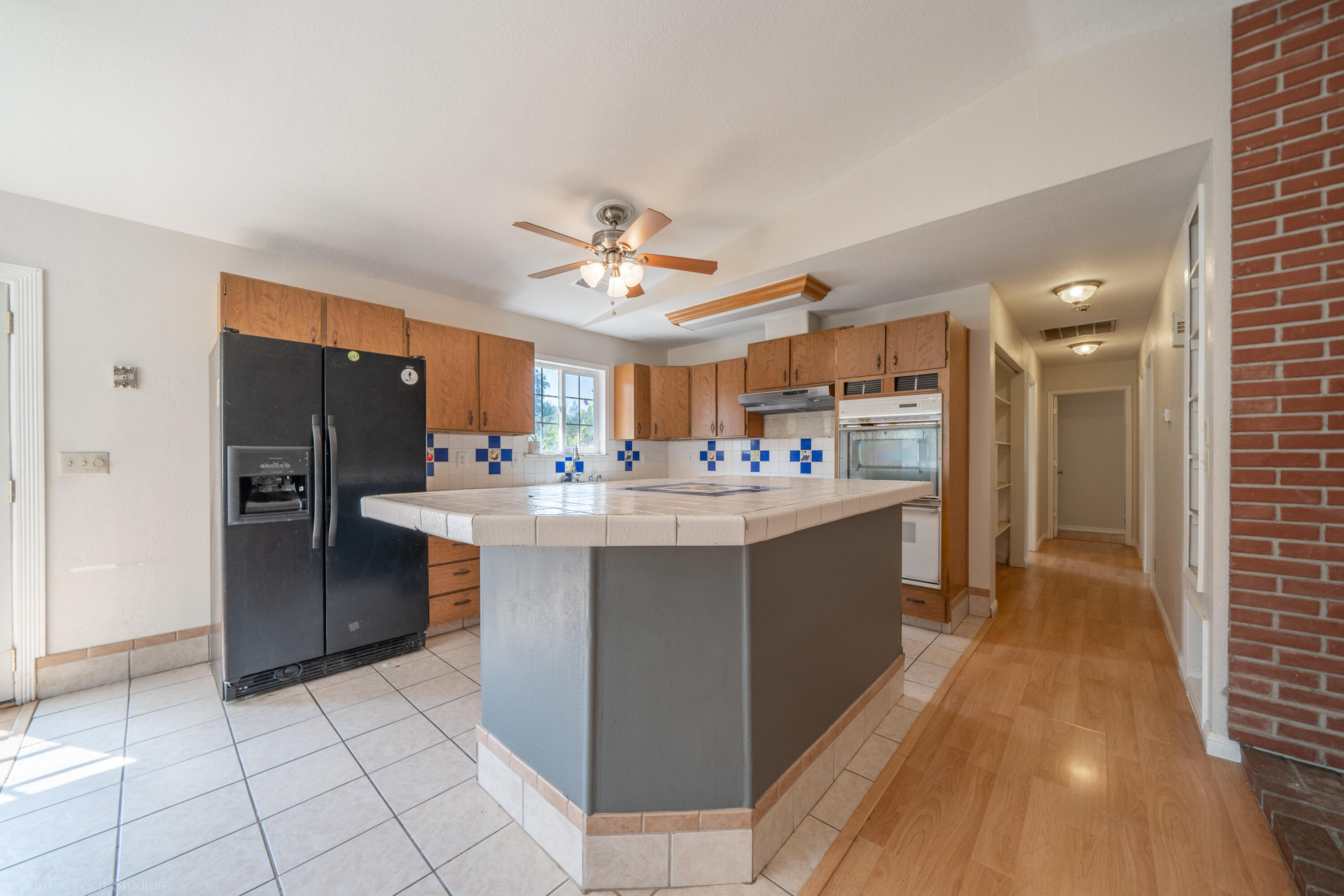 7673 Happy Valley Road Anderson, CA 96007 - Photo 13 of 72 a kitchen with kitchen island a sink appliances and cabinets