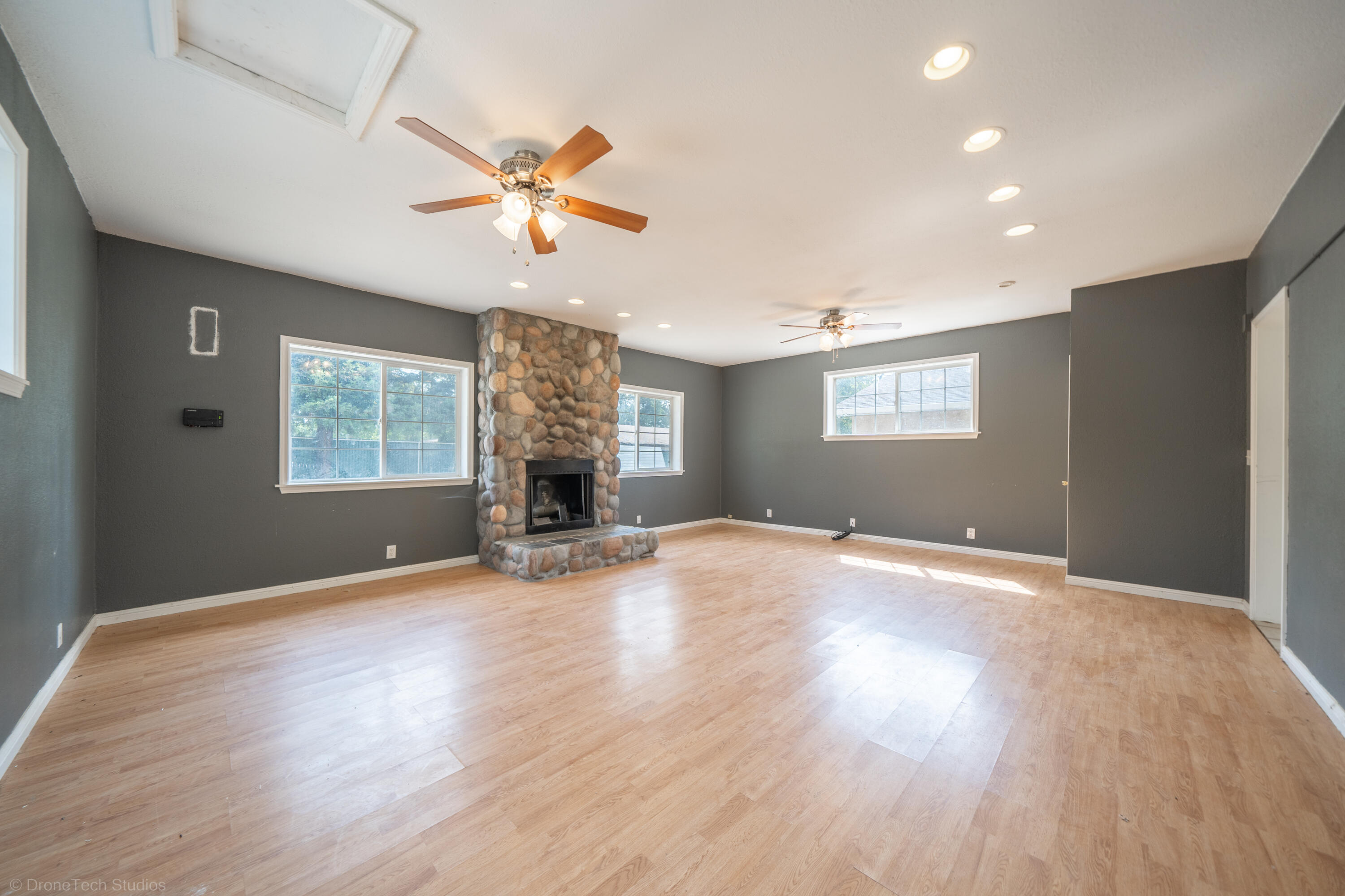 7673 Happy Valley Road Anderson, CA 96007 - Photo 29 of 72 a view of an empty room with window and wooden floor