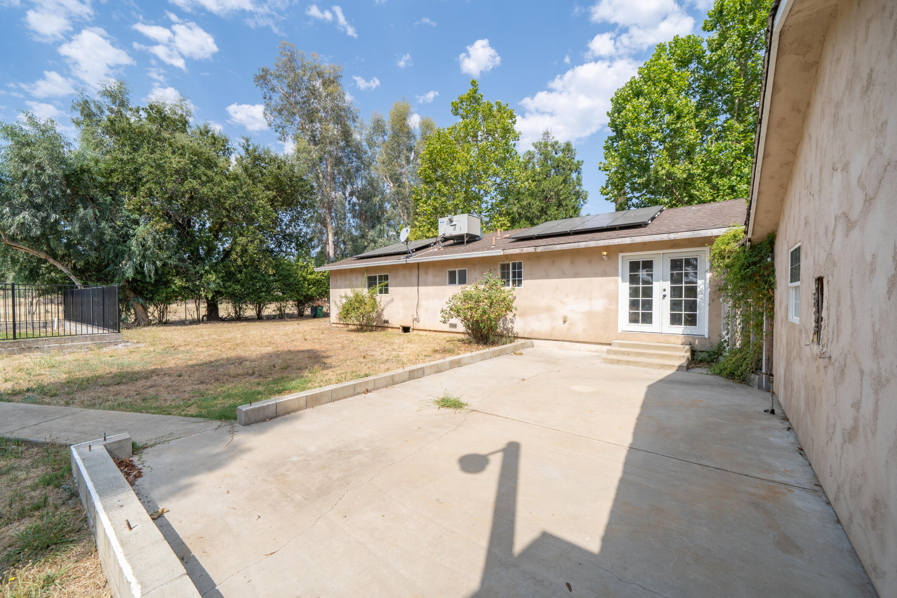 7673 Happy Valley Road Anderson, CA 96007 - Photo 43 of 72 a view of house with yard and trees in the background