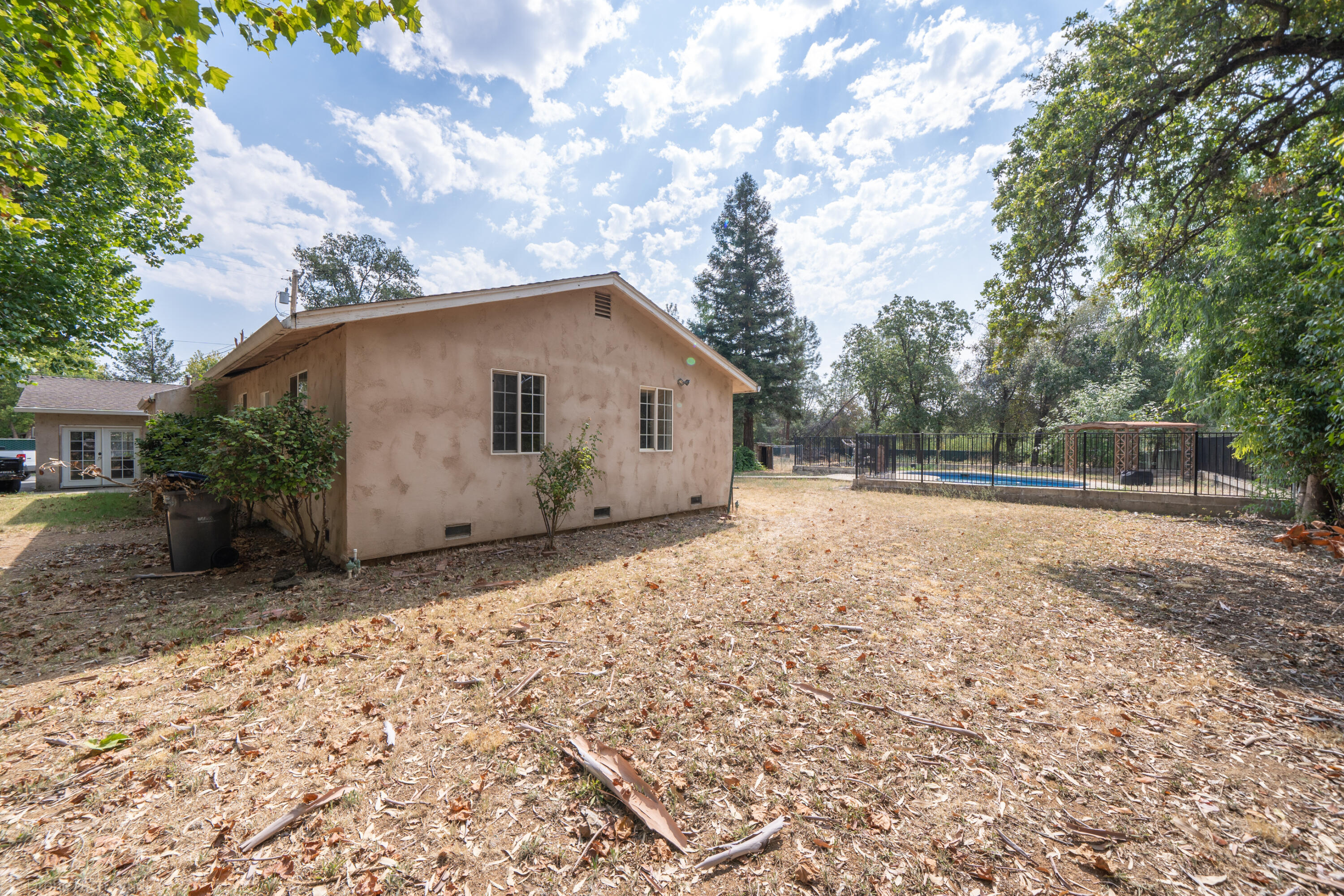 7673 Happy Valley Road Anderson, CA 96007 - Photo 47 of 72 a backyard of a house with lots of green space