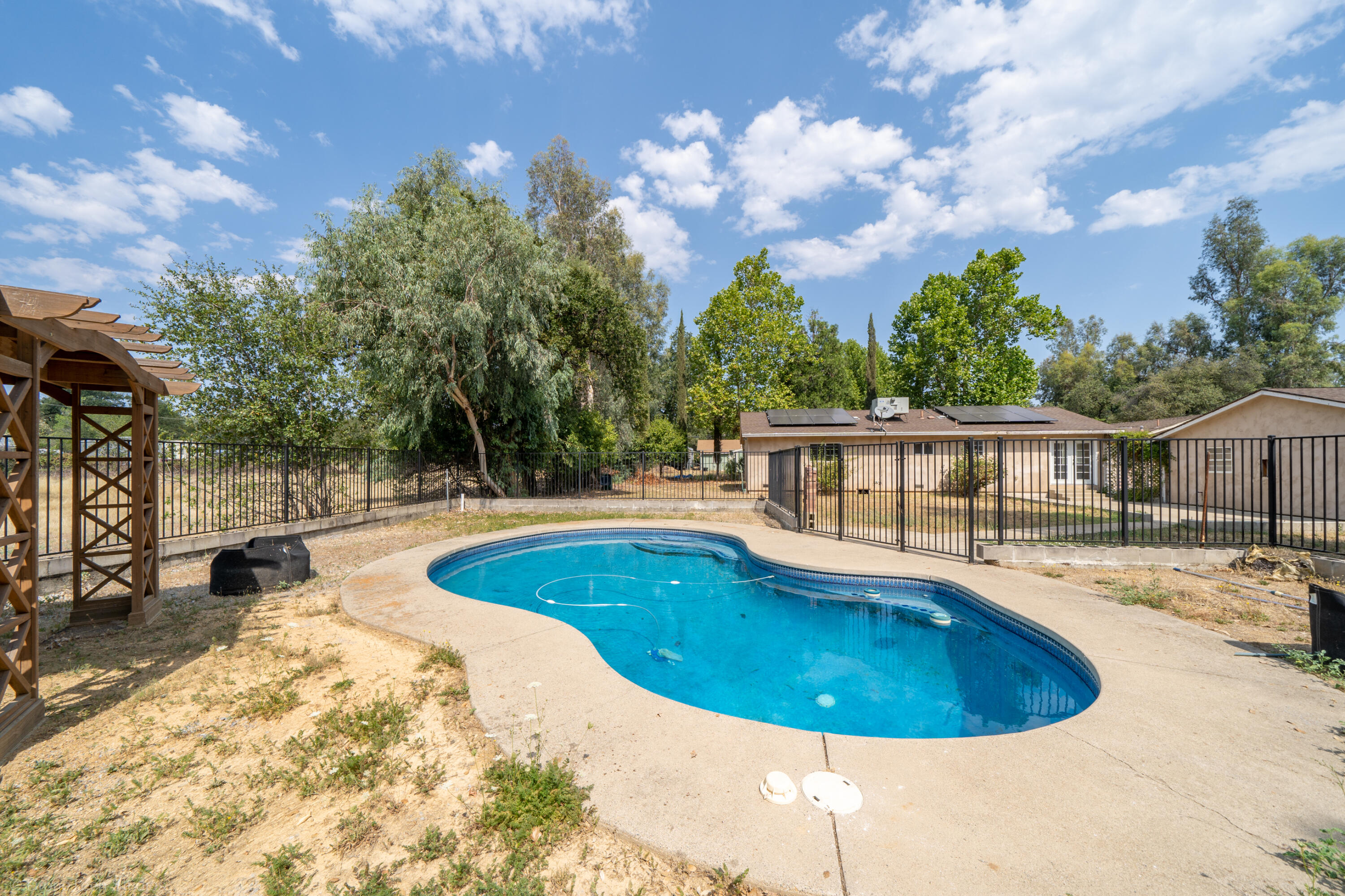 7673 Happy Valley Road Anderson, CA 96007 - Photo 51 of 72 a view of a swimming pool with a patio