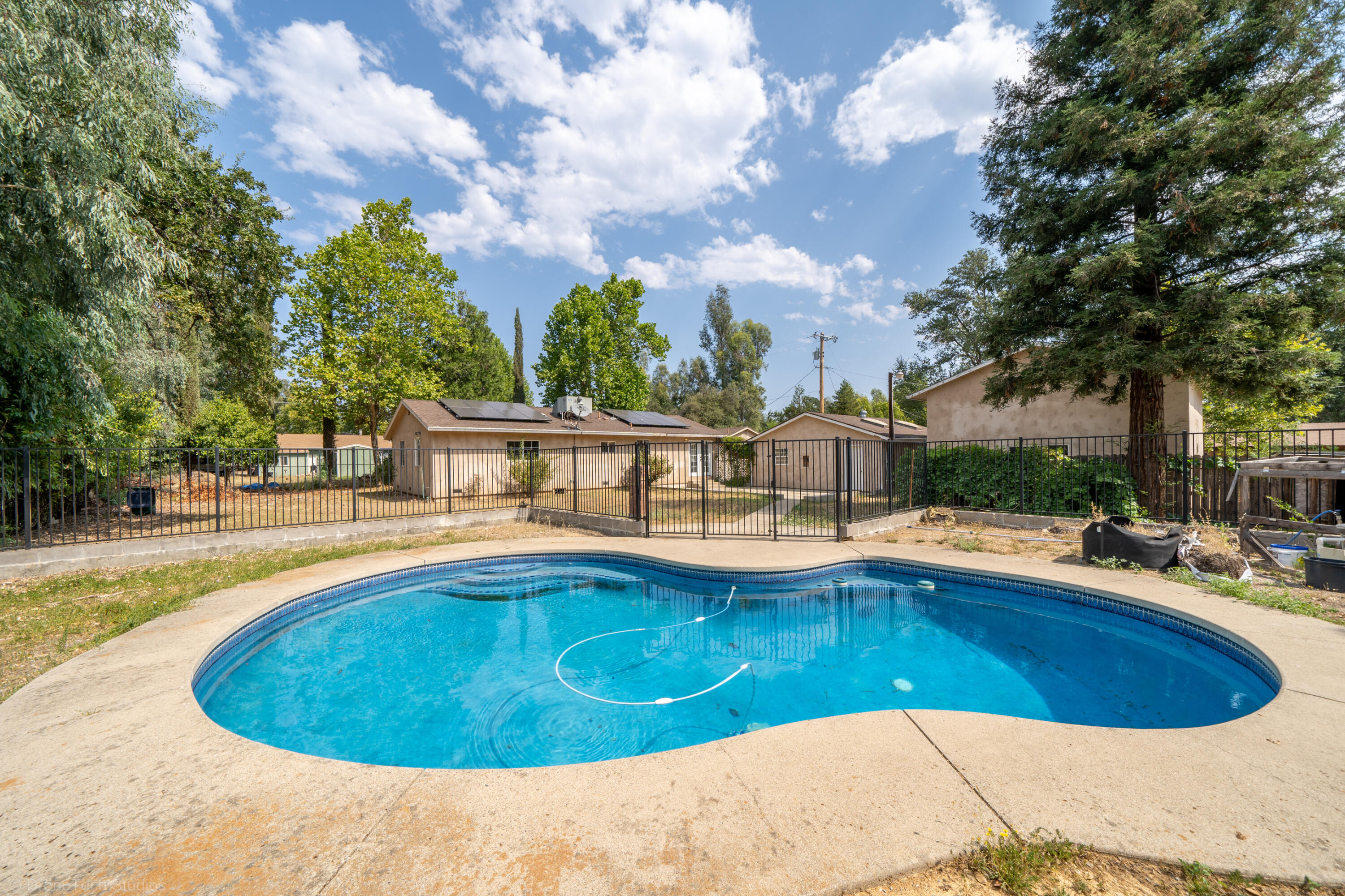 7673 Happy Valley Road Anderson, CA 96007 - Photo 52 of 72 a view of a swimming pool with an outdoor seating