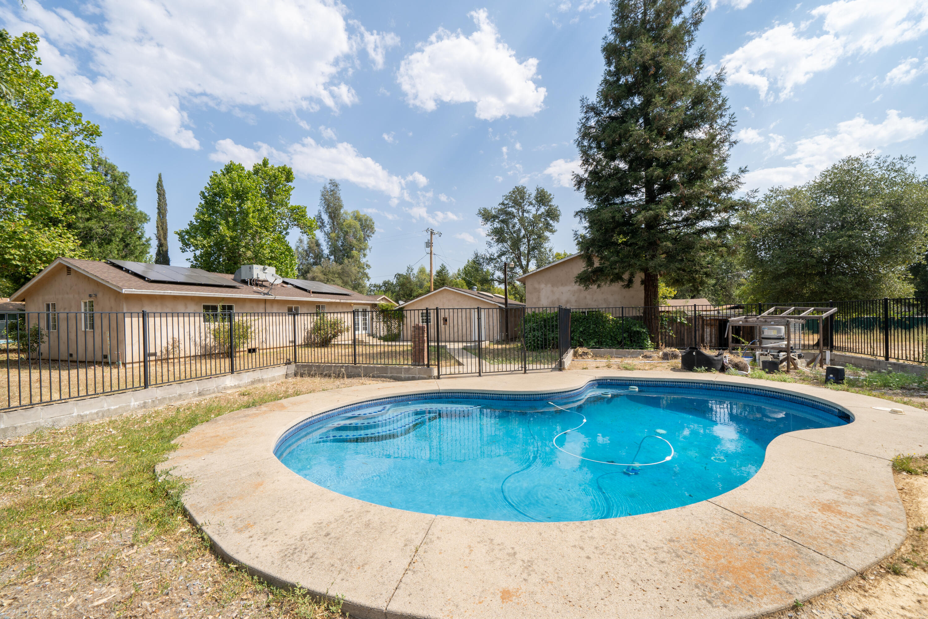 7673 Happy Valley Road Anderson, CA 96007 - Photo 53 of 72 a view of a house with swimming pool and sitting area