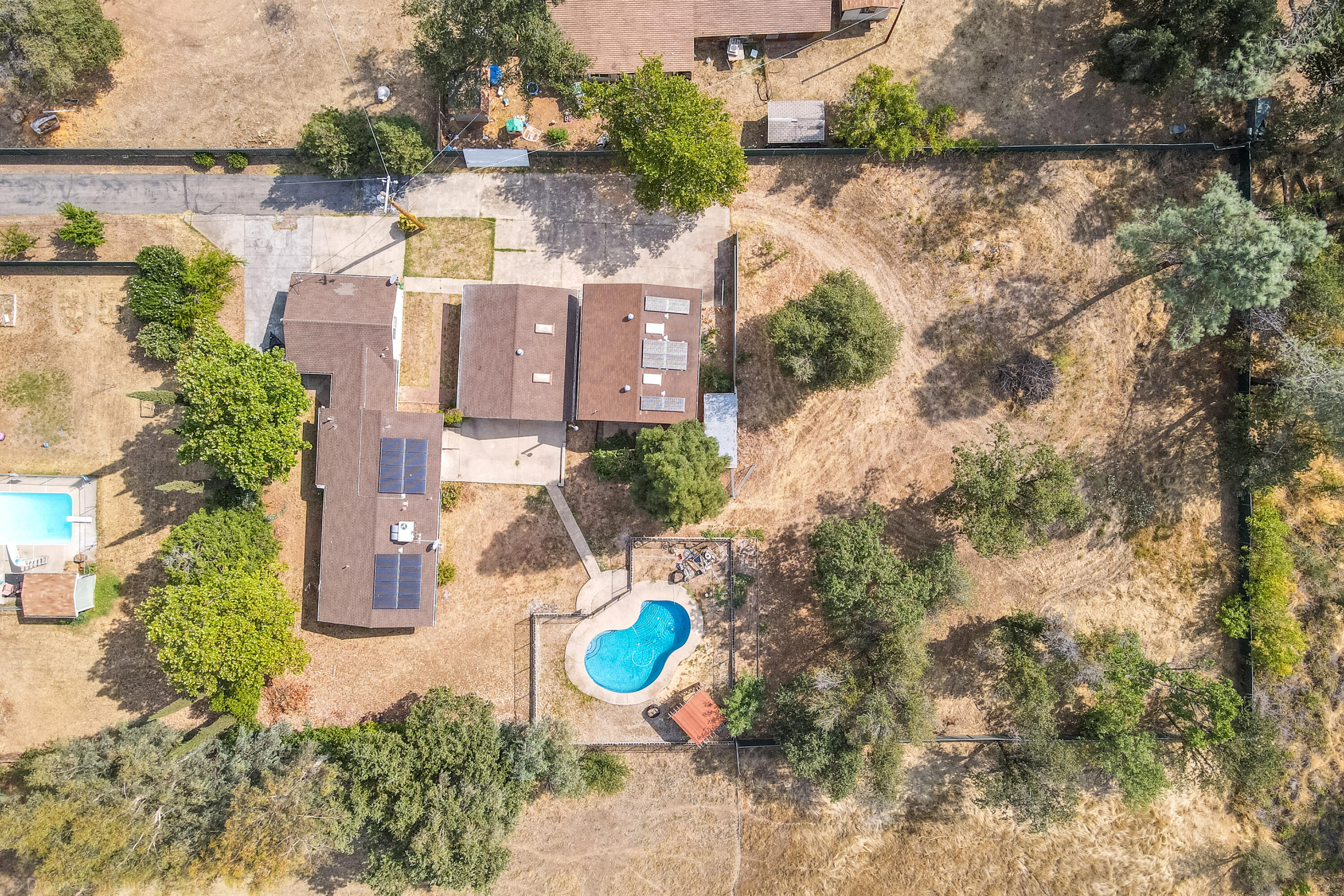 7673 Happy Valley Road Anderson, CA 96007 - Photo 69 of 72 an aerial view of a house with a yard and lake view