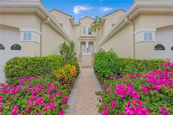 a view of a house with potted plants