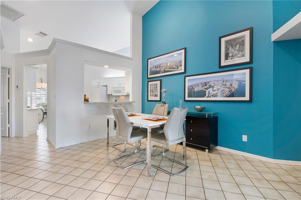 8375 Excalibur Circle, Unit I4 Naples, FL 34108 - Photo 7 of 17 a view of a dining room with furniture