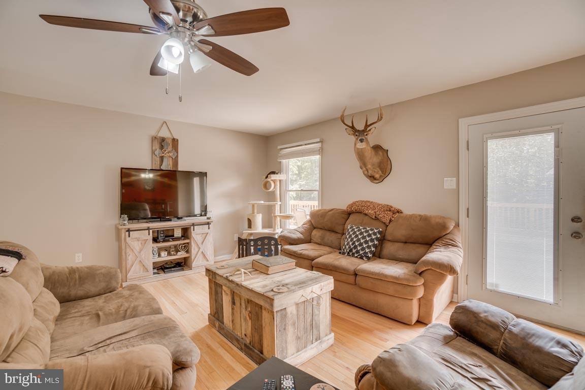 27390 Big H Ranch Road Culpeper, VA 22701 - Photo 13 of 33 Ceiling fan & doors lead to a huge rear deck!