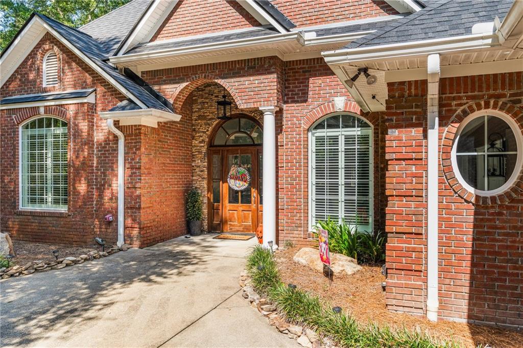 642 Nuckols Road Seale, AL 36875 - Photo 5 of 48 Brick exterior facade with a dark shingle roof