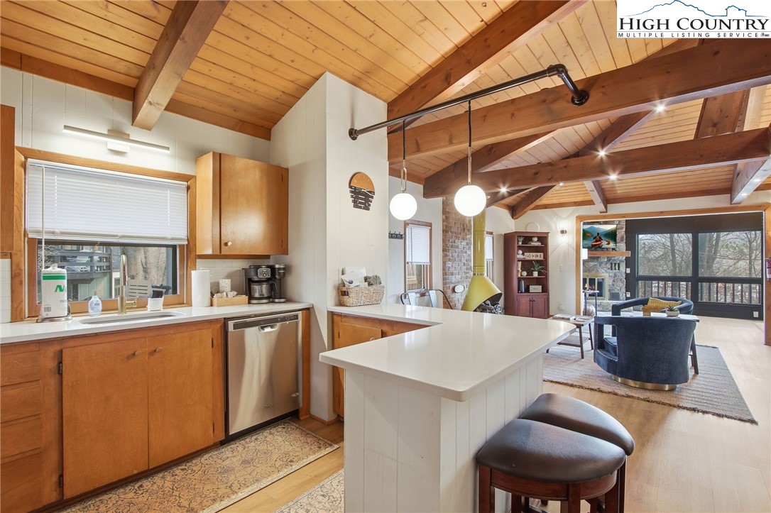 154 Lady Slipper Loop Newland, NC 28657 - Photo 12 of 50 a kitchen with lots of counter top space and stainless steel appliances