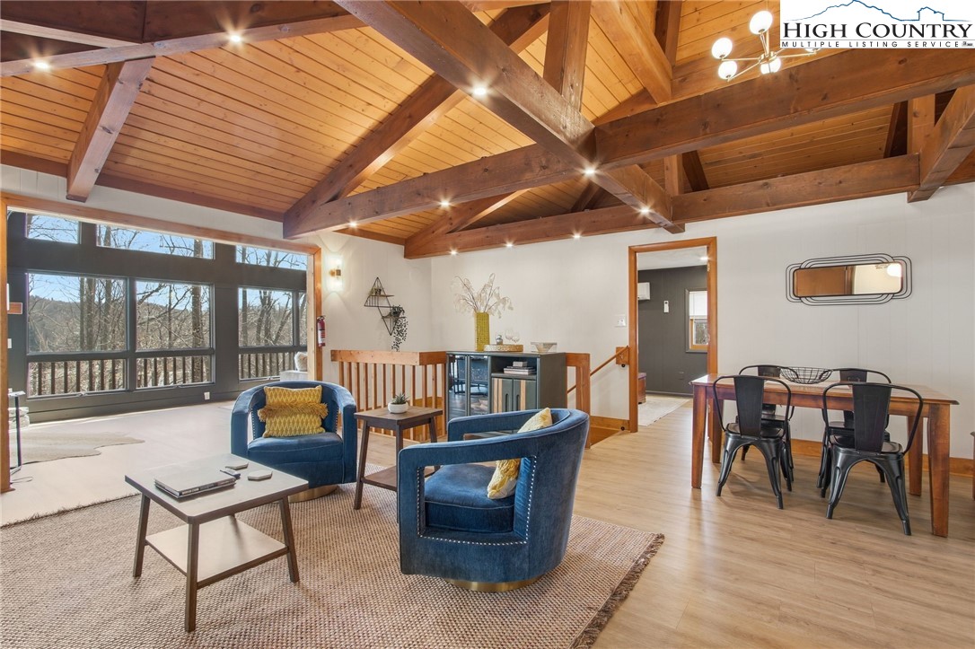 154 Lady Slipper Loop Newland, NC 28657 - Photo 16 of 50 a living room with furniture and a wooden floor
