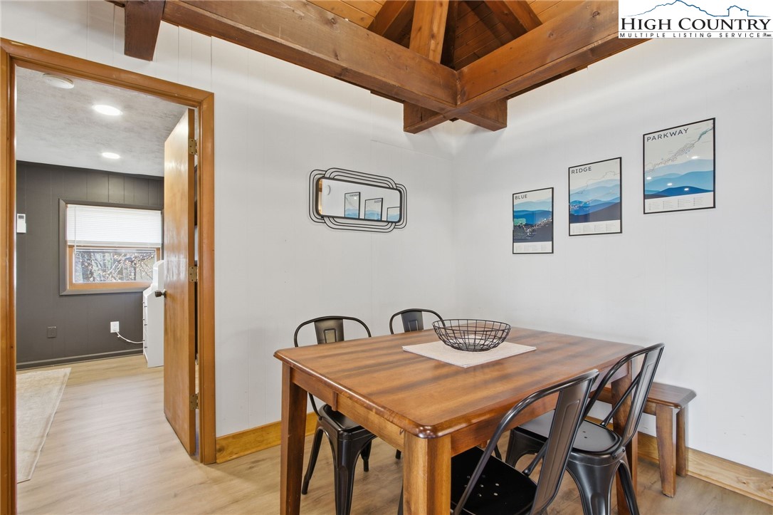 154 Lady Slipper Loop Newland, NC 28657 - Photo 19 of 50 a dining room with a table and chairs