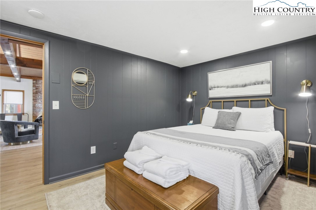 154 Lady Slipper Loop Newland, NC 28657 - Photo 23 of 50 a bedroom with a bed and a painting