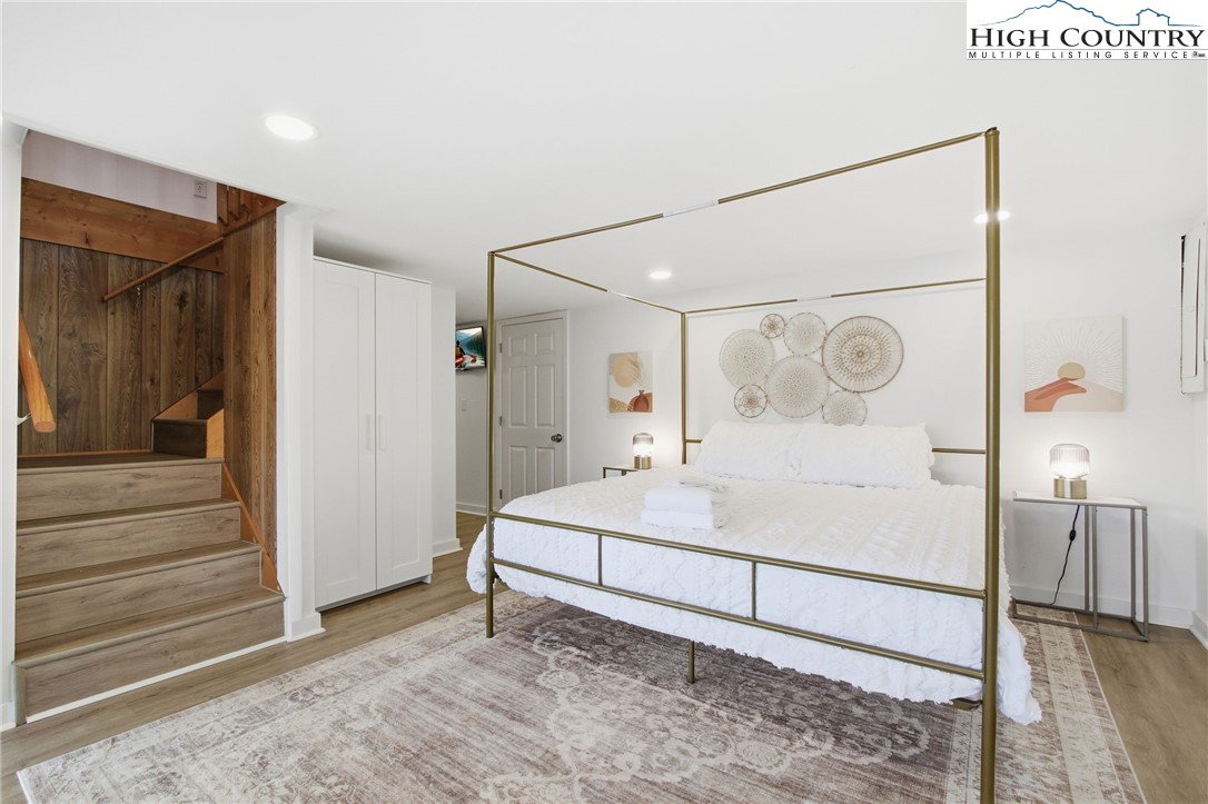 154 Lady Slipper Loop Newland, NC 28657 - Photo 27 of 50 a room with a bed and a mirror