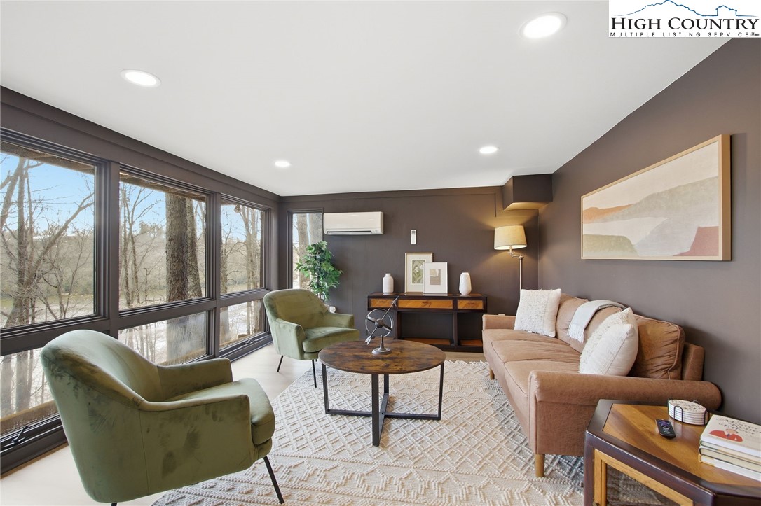 154 Lady Slipper Loop Newland, NC 28657 - Photo 28 of 50 a living room with furniture and a large window