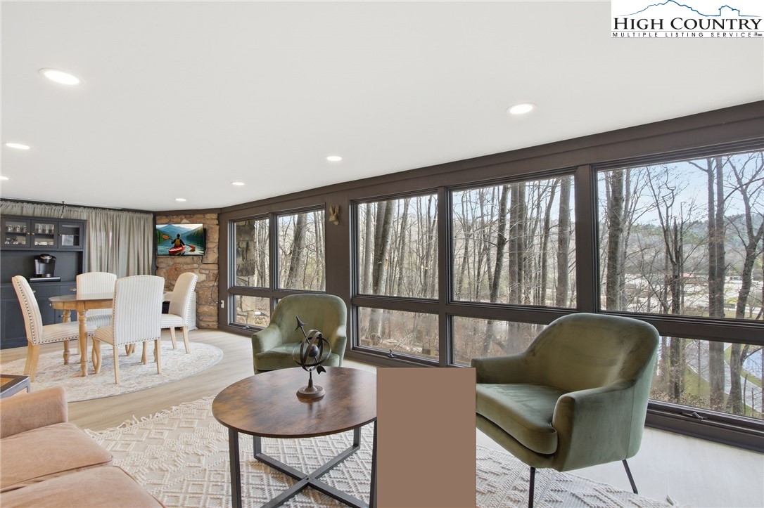 154 Lady Slipper Loop Newland, NC 28657 - Photo 29 of 50 a living room with furniture and a large window