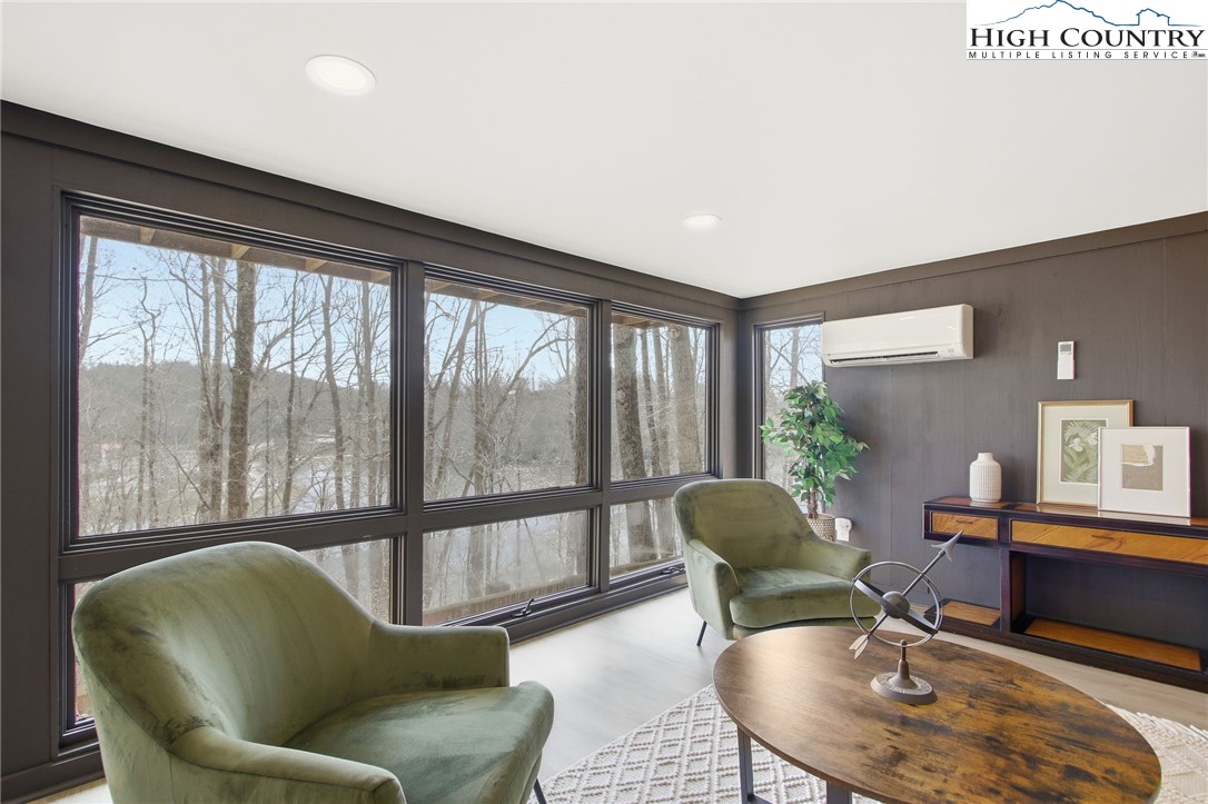 154 Lady Slipper Loop Newland, NC 28657 - Photo 31 of 50 a living room with furniture and a large window
