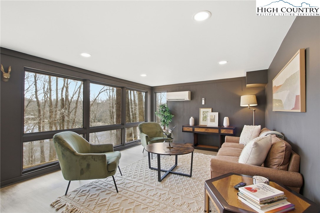 154 Lady Slipper Loop Newland, NC 28657 - Photo 32 of 50 a living room with furniture and a large window