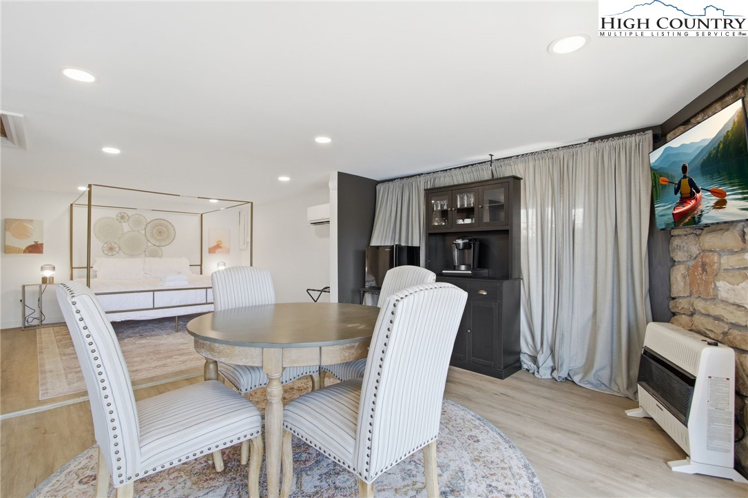 154 Lady Slipper Loop Newland, NC 28657 - Photo 35 of 50 a dining room with furniture and wooden floor