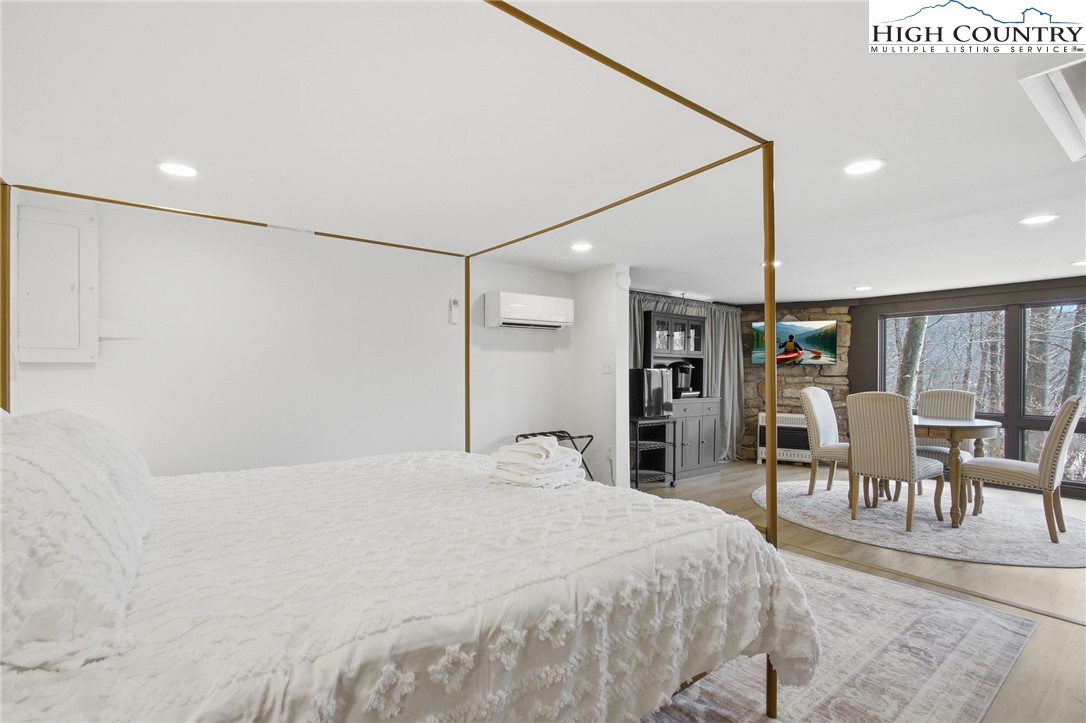 154 Lady Slipper Loop Newland, NC 28657 - Photo 36 of 50 a bed room with a bed and a chair