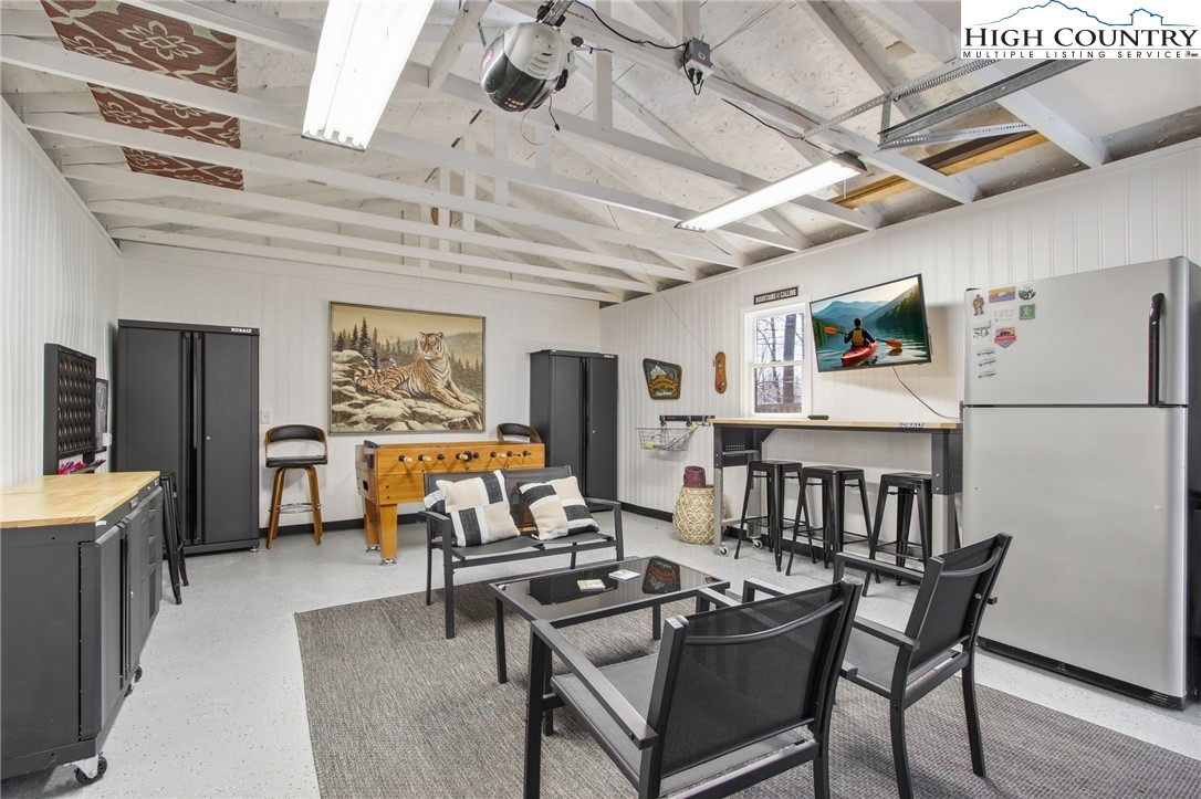 154 Lady Slipper Loop Newland, NC 28657 - Photo 43 of 50 a reading room with furniture pool table and paintings on the wall