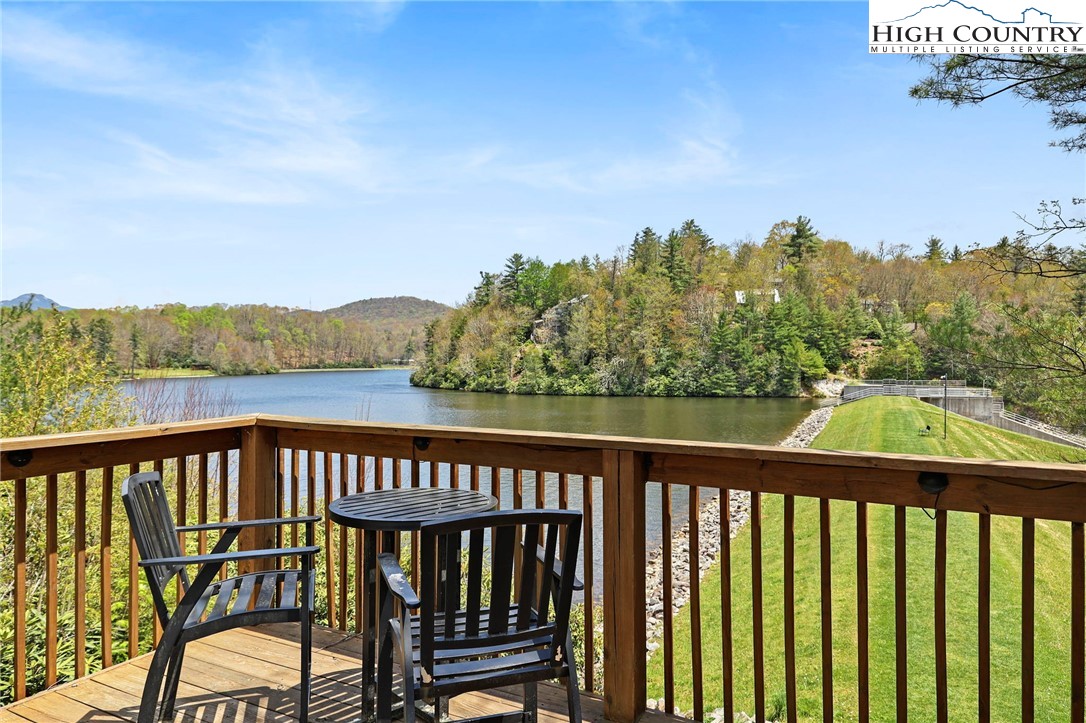 154 Lady Slipper Loop Newland, NC 28657 - Photo 44 of 50 a view of a balcony with wooden floor and fence