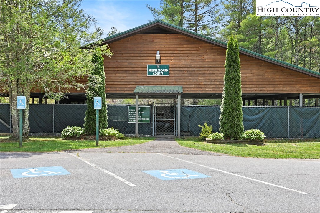154 Lady Slipper Loop Newland, NC 28657 - Photo 45 of 50 a view of a house with a yard and a large tree