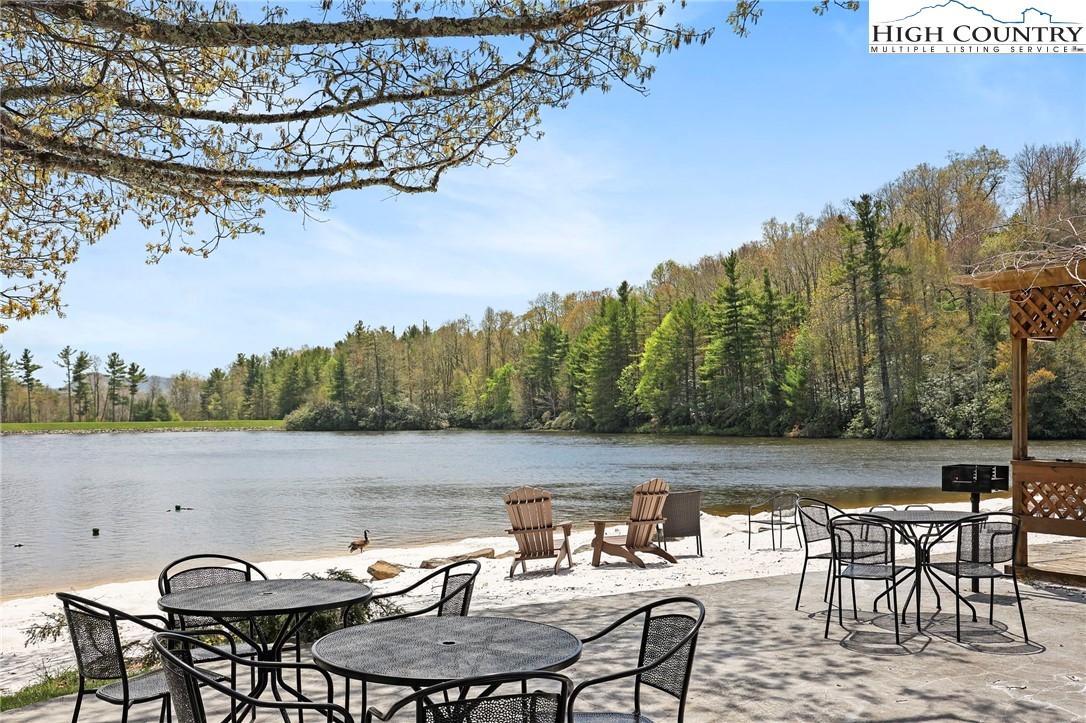 154 Lady Slipper Loop Newland, NC 28657 - Photo 48 of 50 a view of a lake with furniture
