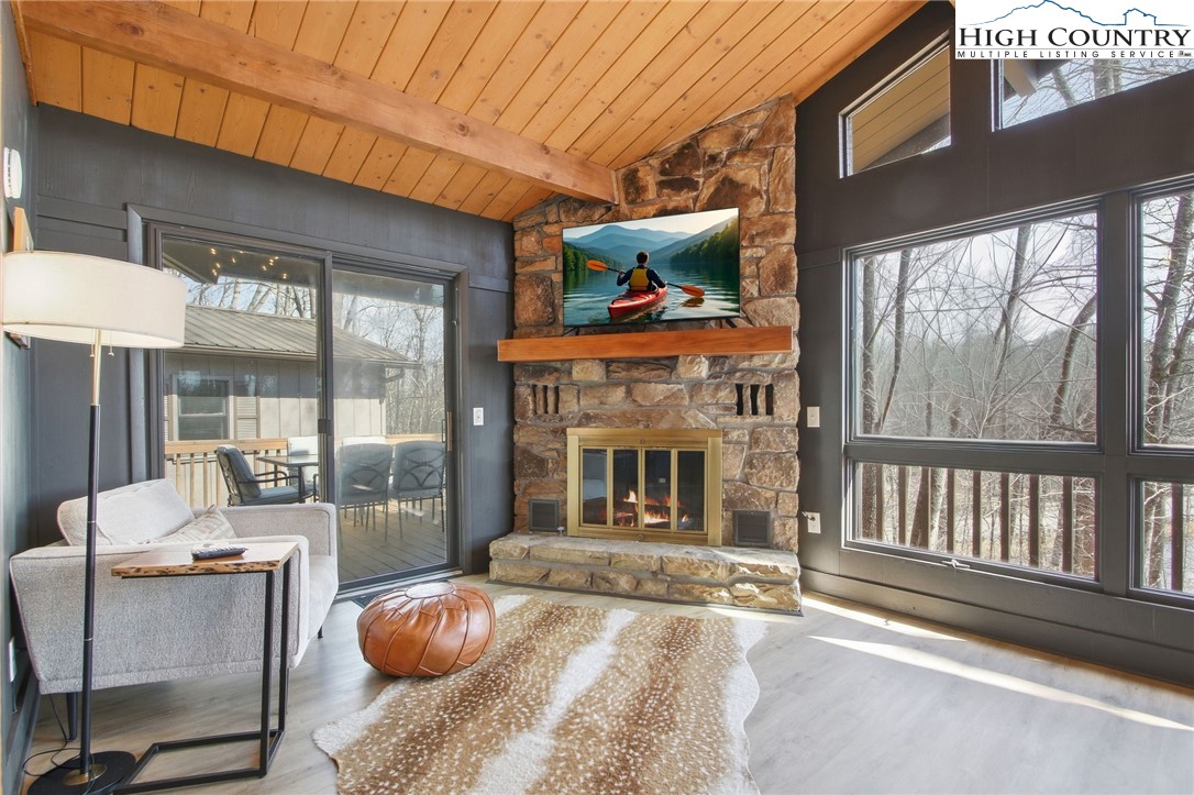 154 Lady Slipper Loop Newland, NC 28657 - Photo 7 of 50 a view of a patio with a table and chairs and potted plants