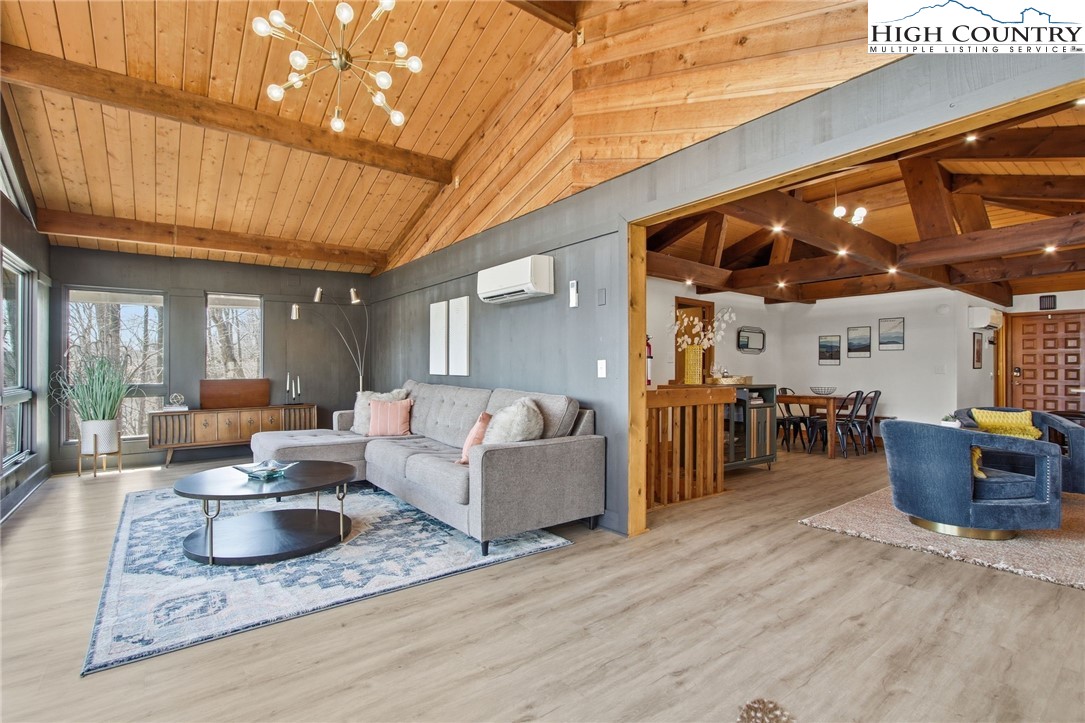 154 Lady Slipper Loop Newland, NC 28657 - Photo 8 of 50 a living room with furniture and a wooden floor