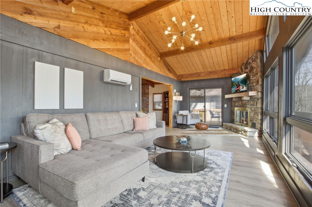 154 Lady Slipper Loop Newland, NC 28657 - Photo 9 of 50 a living room with furniture and a potted plant